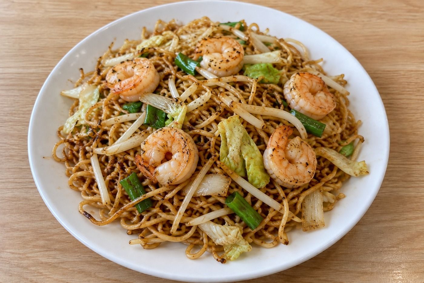 AI illustration of shrimp chow mein with vegetables on a white plate