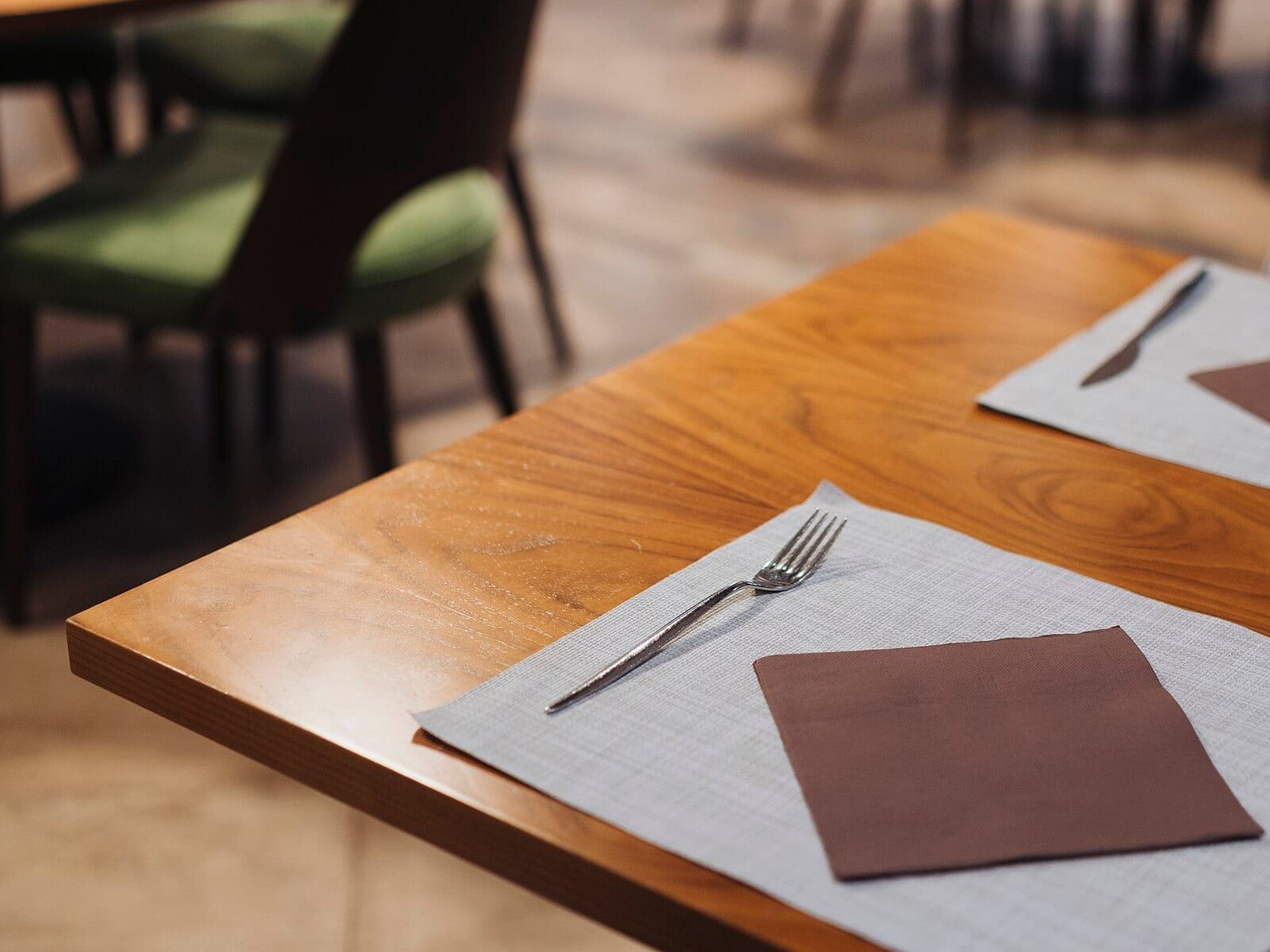 A restaurant table set for guests