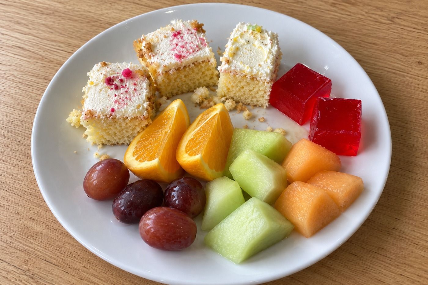AI illustration of sponge cake, gelatin and fresh fruit on a dessert plate